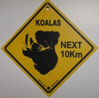 Warnschild Koala next 10 km / next 4 km
